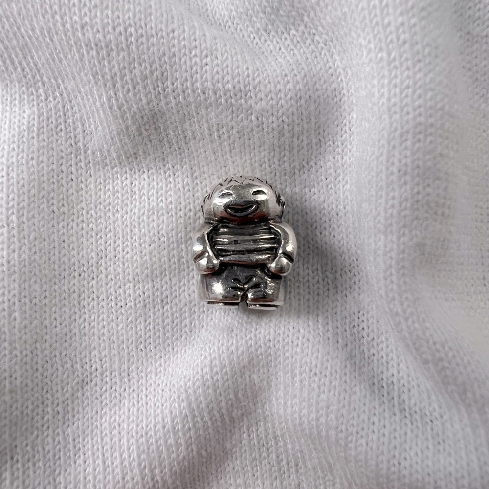 Authentic pandora 925 silver threaded core little boy charm.